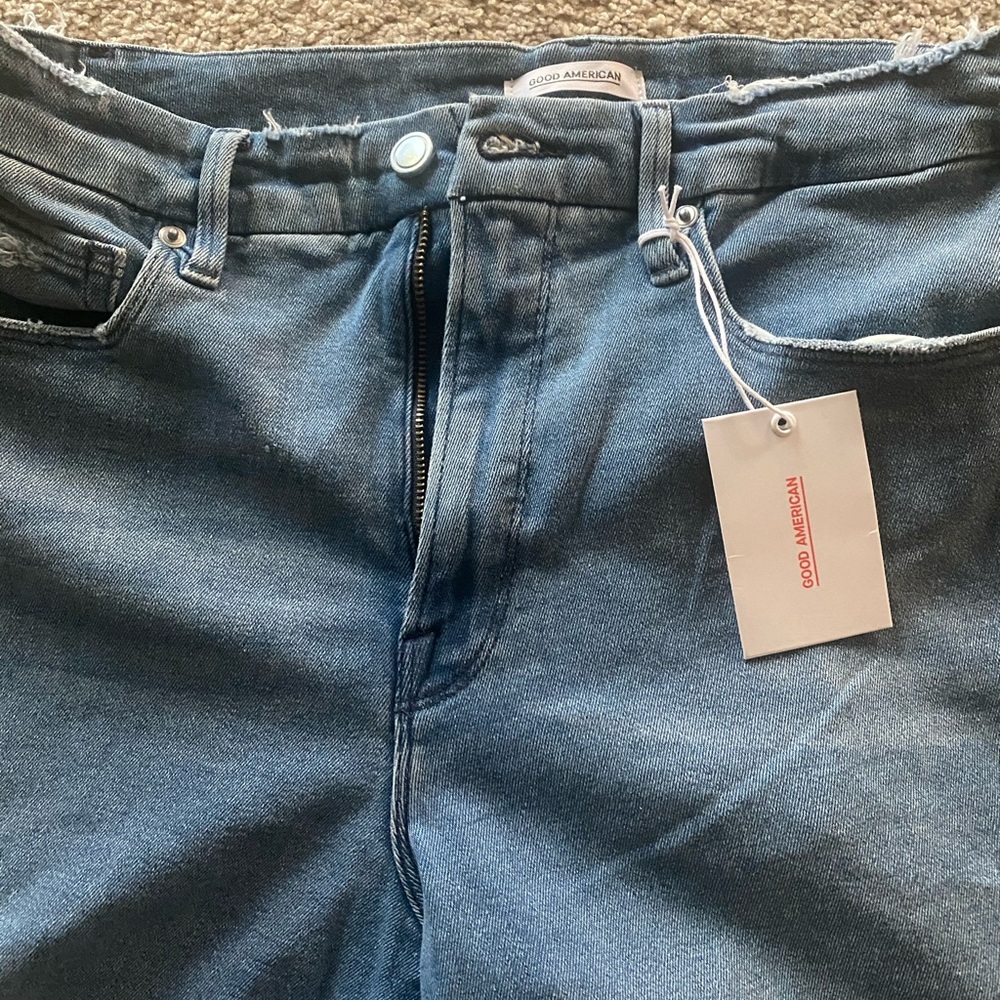 Brand new Good American raw edge bootcut jeans